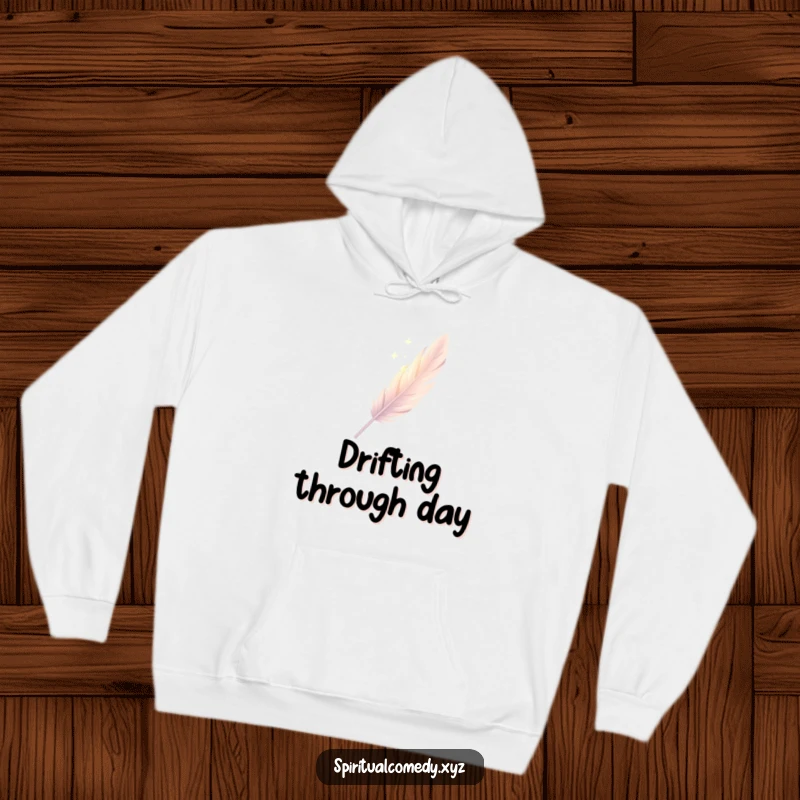Funny hoodie featuring a single, elegantly drawn feather descending gently through soft diffused light, offering cozy elegant humor.